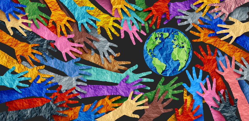 International diversity or earth day and international world culture as a concept of diversity and crowd cooperation symbol as diverse hands holding together the planet earth