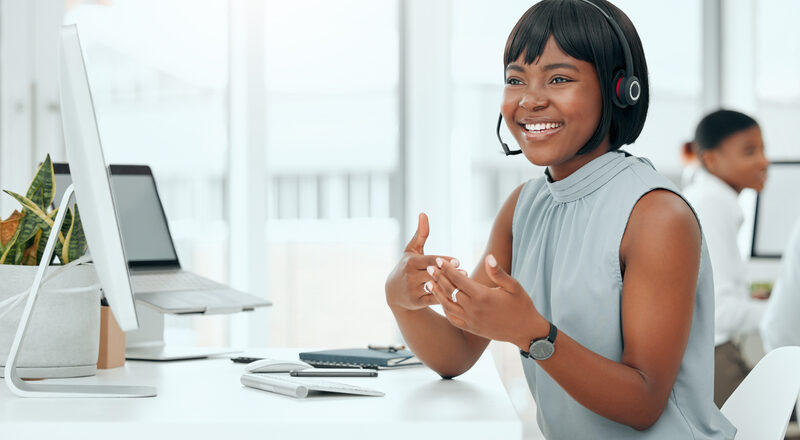 Call center, woman and agent with headset talking to client for customer service, technical support and advice.