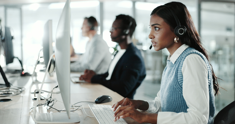 all center, computer and typing with Indian woman in support office for customer service