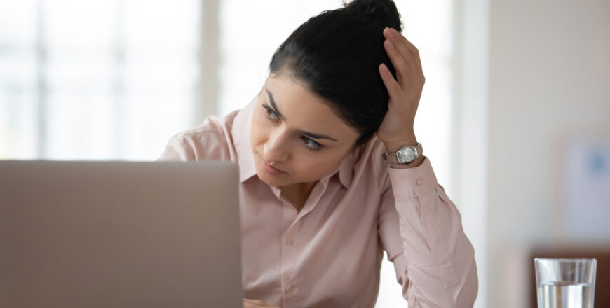 head shot unhappy young female hindu employee feeling stressed at workplace.