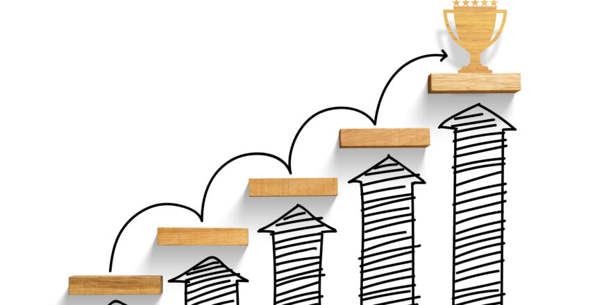 wooden staircase to reach goal and win trophy with increase graph and arrow